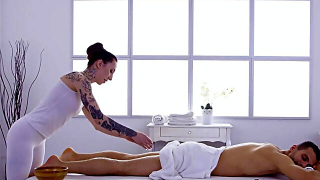 Inked massuese doggyfucked by client