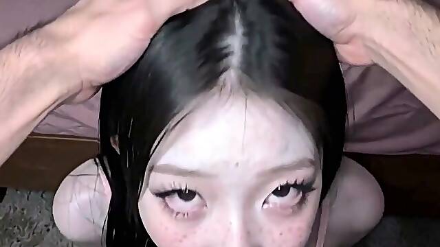 Girl with long black hair kneels for deepthroat on bedroom