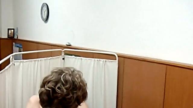 Mature white lady shows her hairy vulva to a gynecologist
