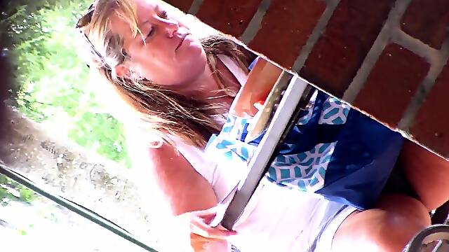 Striking mature lady with sexy legs voyeur upskirt outside