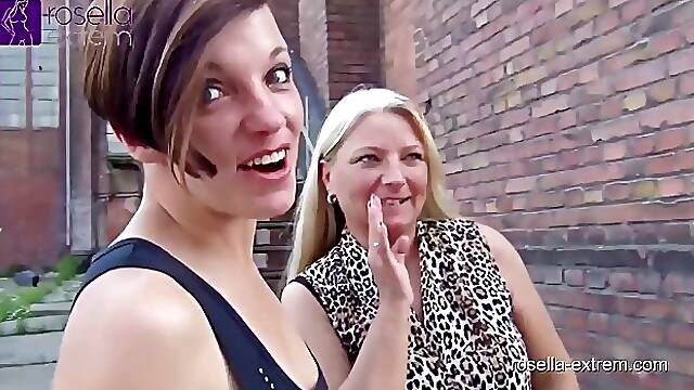 Two naughty ladies, Roxy and Rosella are showing their pussies in a public place and pissing