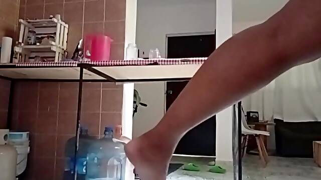 Aged bulky Lalin girl in a strap at home