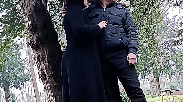 Muslim woman plays and blows a large cock outside in the park