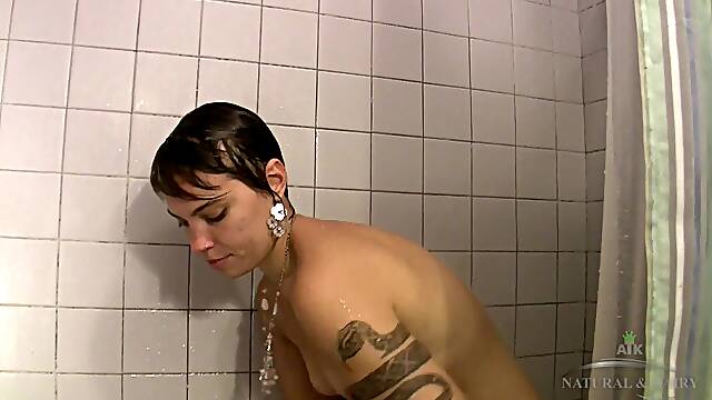 Artemisia is a short haired natural cutie and she starts this clip by peeing on camera