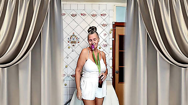 A Mature Ukrainian Woman Shows off Her Figure and Poses for the Camera at Home